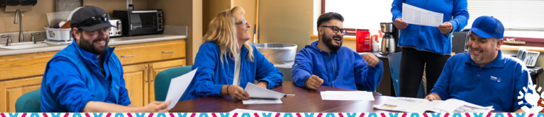 Picture of Staff around break room table 